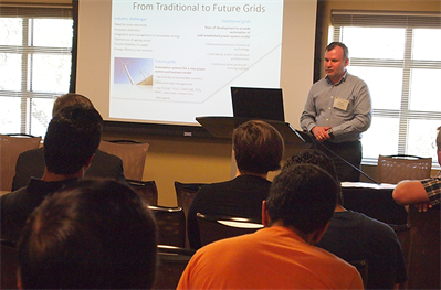 Image of a presenter with a slide titled "From Traditional to Future Grads"