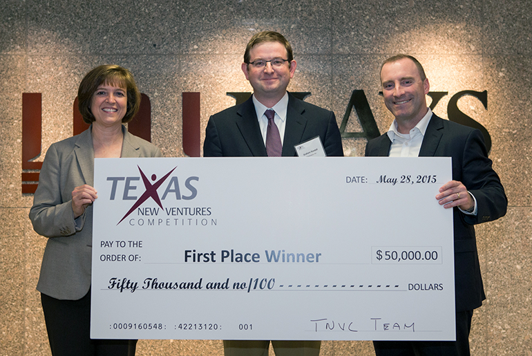 New Venture award winners holding a check