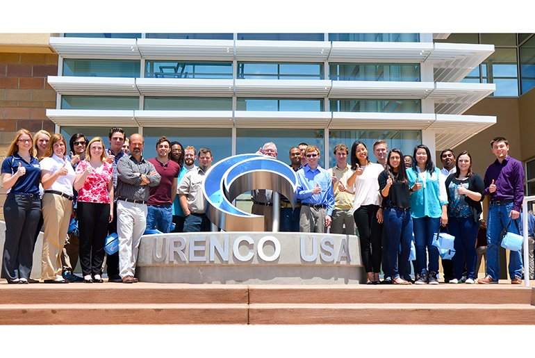 Student standing in front of Urenco USA building