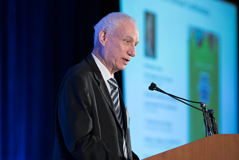 Dr. Alan Needleman speaking at conference
