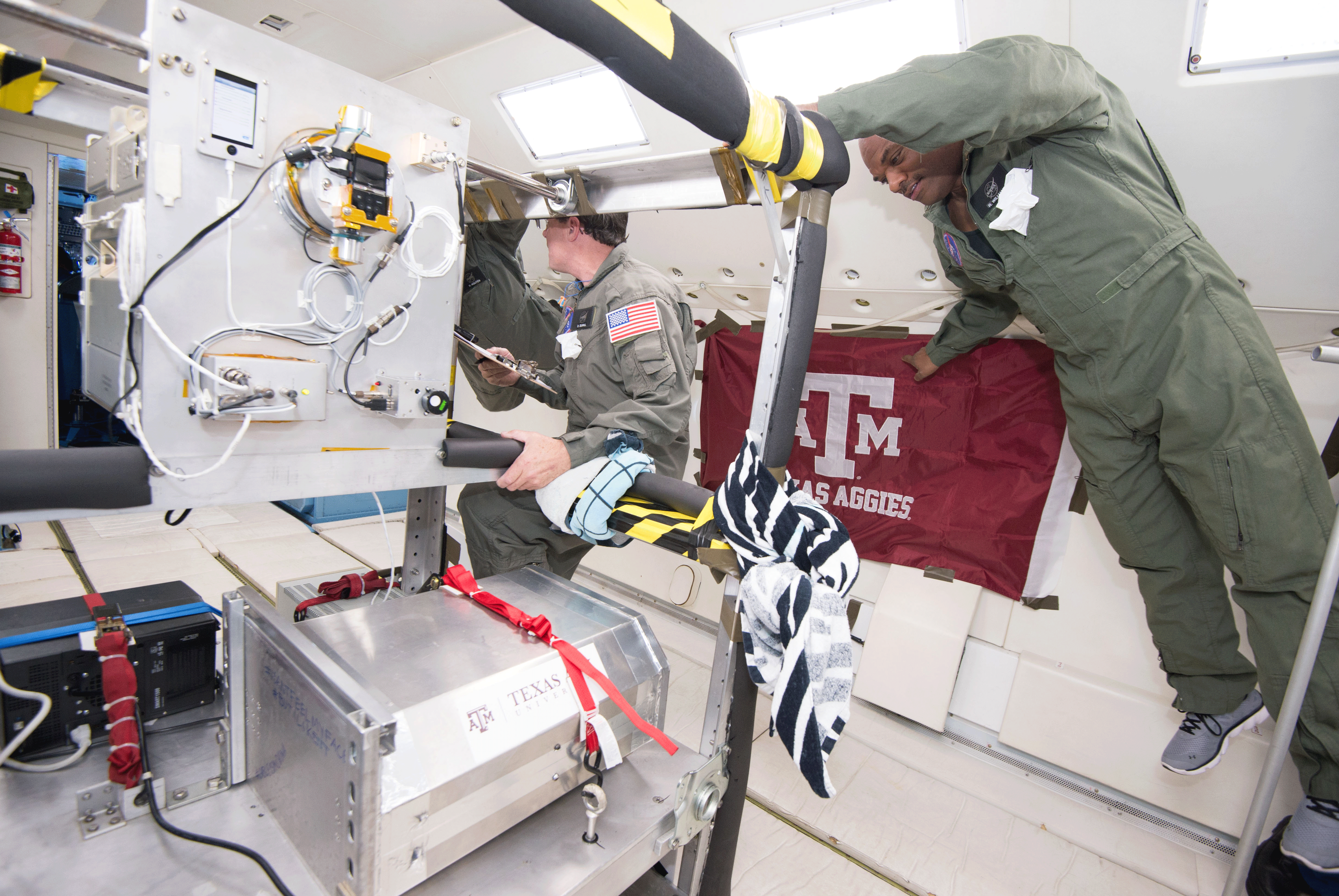 Three Individuals In NASA’s Reduced Gravity Aircraft 