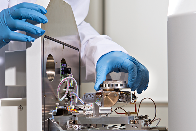 Scientist Handling Mechanical Equipment