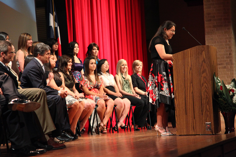 Castanon On Stage Giving A Speech To An Audience