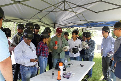 Image of individuals wearing hardhats 