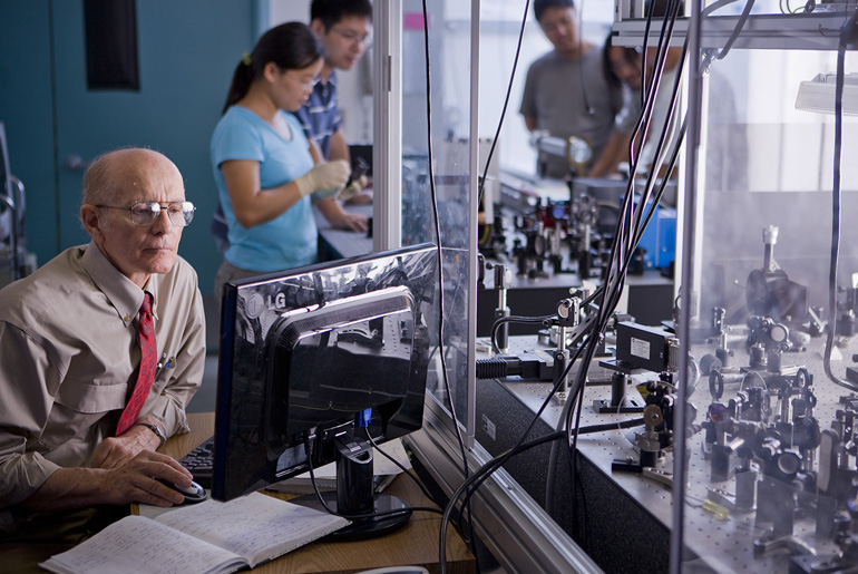 Marlan O. Scully working in quantum optics lab.