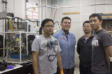 Image of four individuals in a laboratory