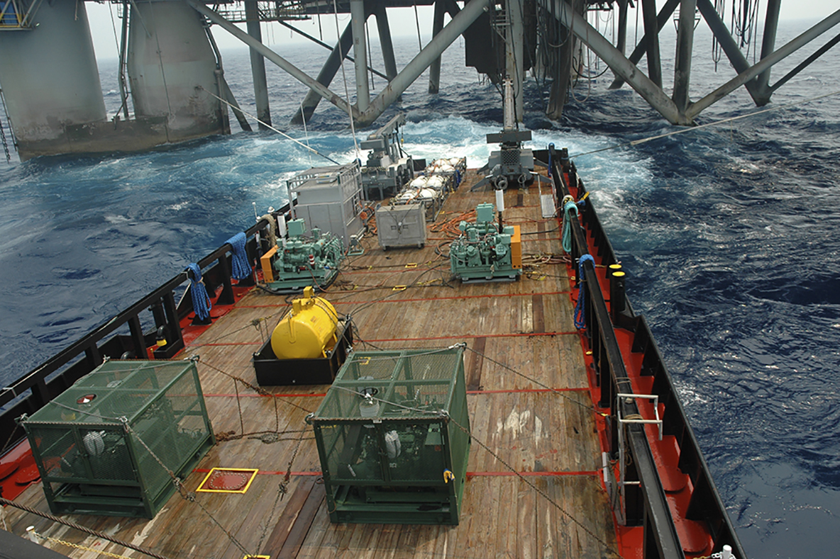 small cargo ship in ocean