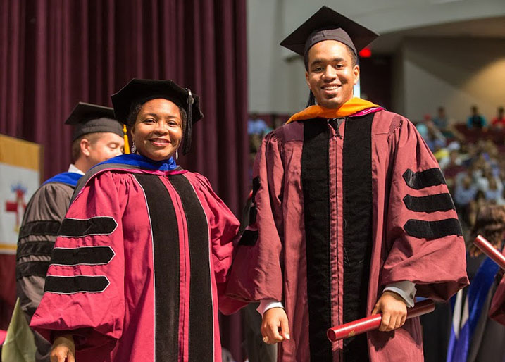 Dr. Cortlan Wickliff in graduation gown
