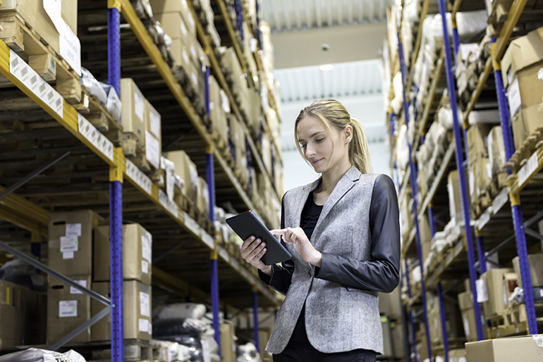 Woman in warehouse doing inventory