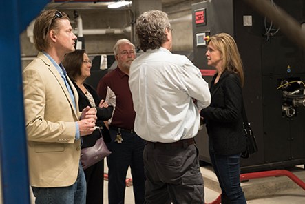 Kristina Swallow touring facility with other people.