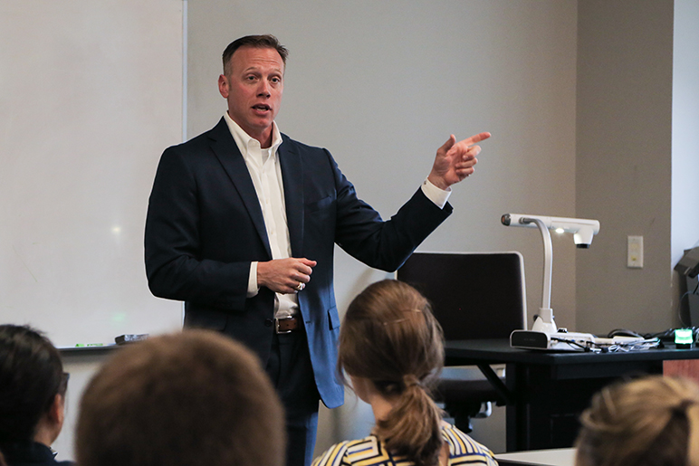 Ryan Sitton presenting in front of an audience