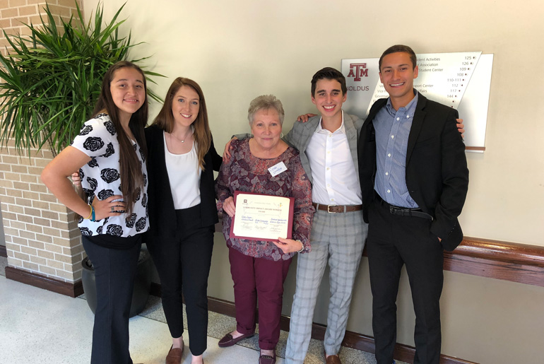 Team receiving certificate