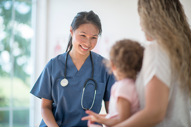 Doctor helping a child