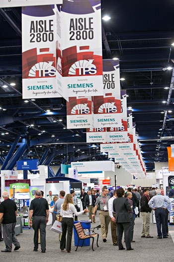 An aisle at the TURBOMACHINERY &amp; PUMP SYMPOSIUM exhibit floor