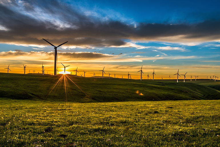 wind turbines at sunset