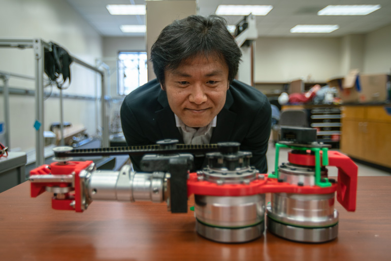Dr. Pilwon Hur with human-like efficient locomotor prosthesis device.