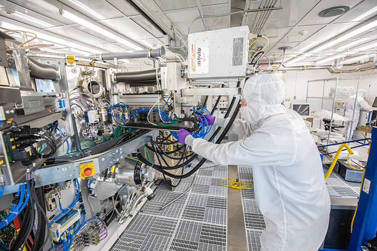 Researcher in lab using donated equipment from Hewlett Packard