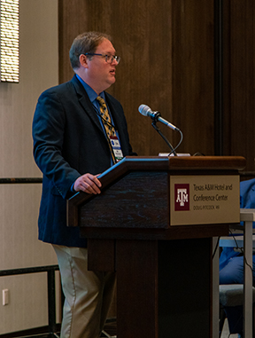 Gilbert Bindewald addressing a conference at TAMU Hotel and Conference center
