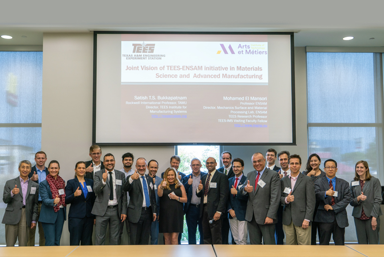 Group shot of workshop attendees doing thumbs up 