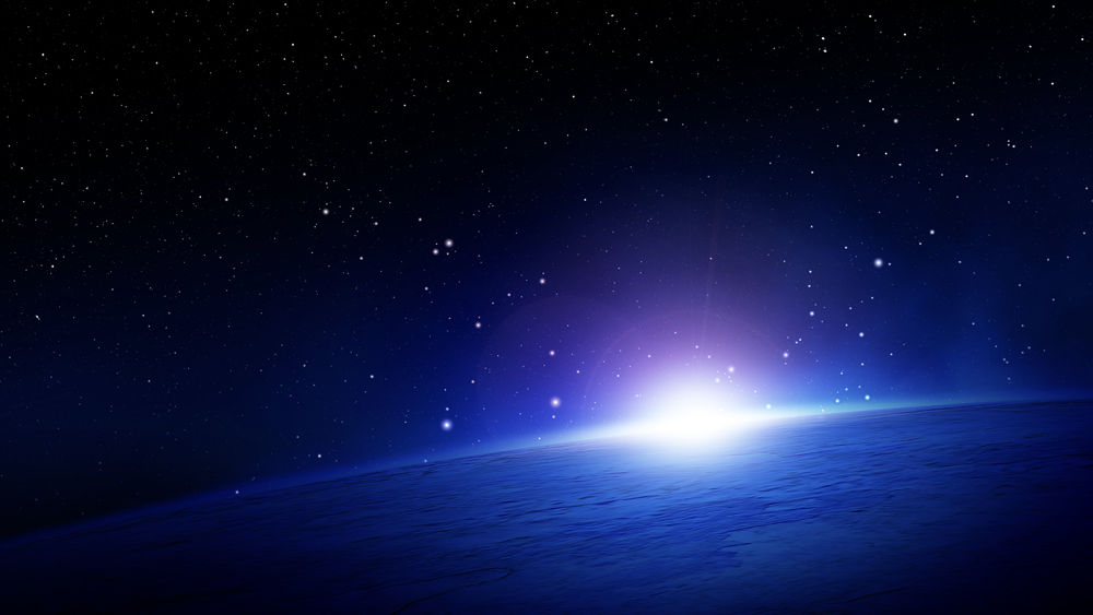 Lens flare over the curvature of the earth in outer space.