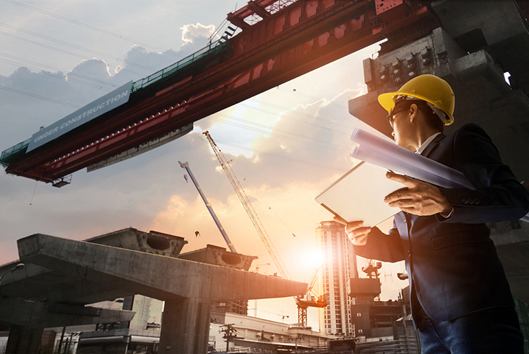 Architect looking at construction beam