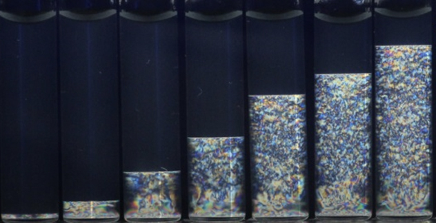 Vials containing zirconium phosphate in increasing concentrations from left to right.