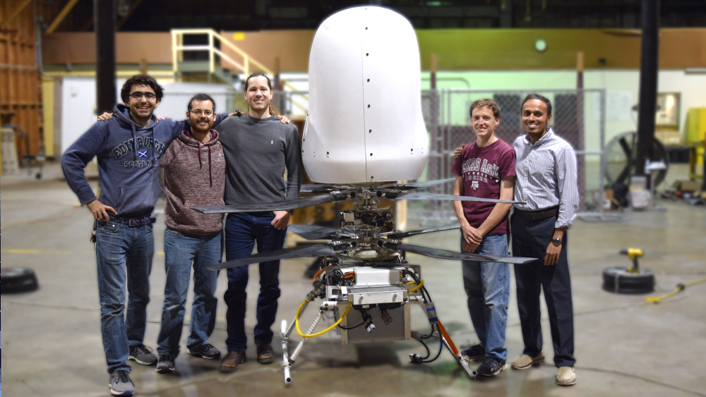 Harmony Aeronautics team standing beside their invention.