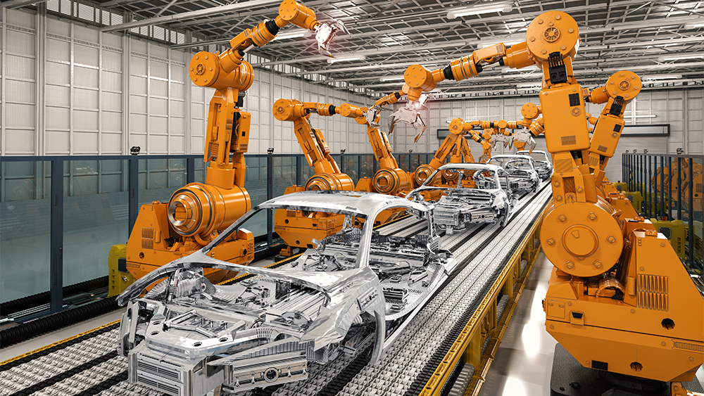 Machines building steel car frames.