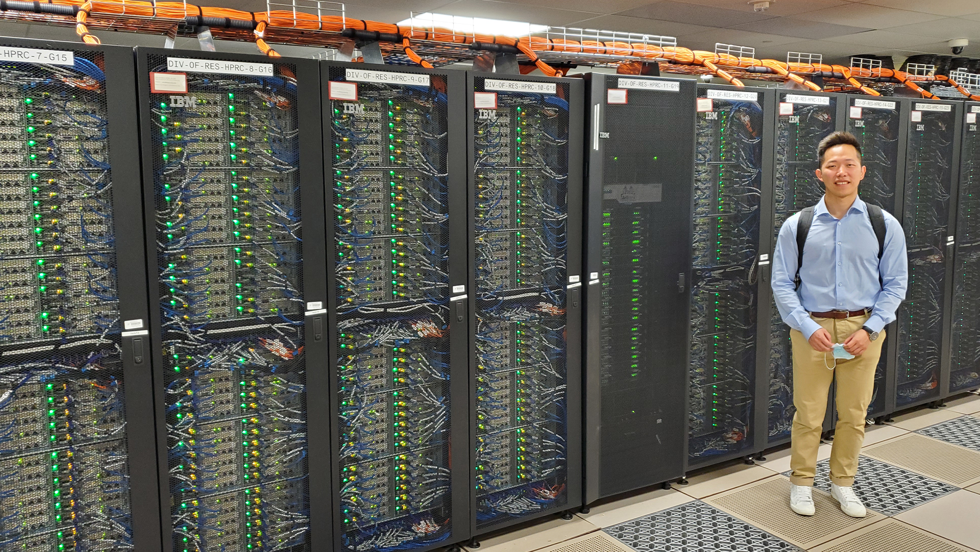Student, Jiayi Lin, is pictured with a super computer that is used to solve optimization problems. 