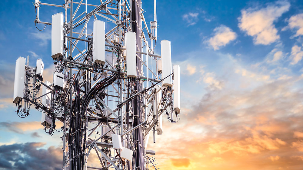 Cell tower with sunset in background