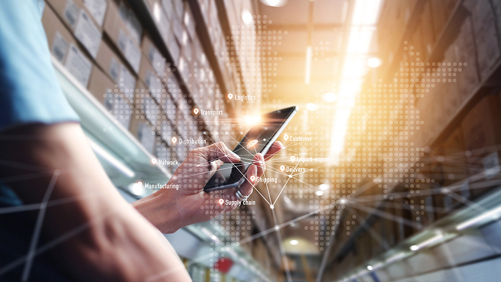 Worker using application smartphone checking and control on global logistics network distribution.