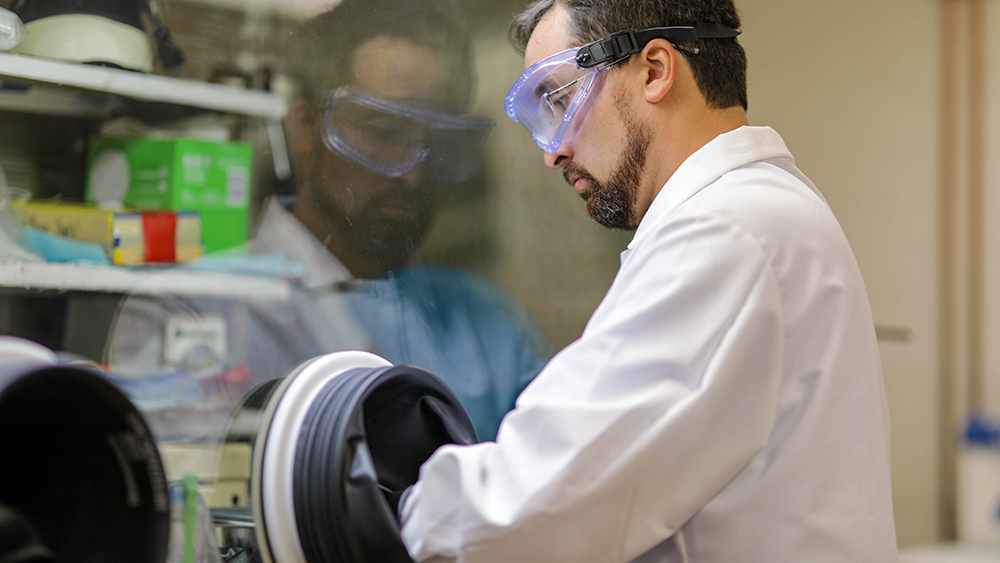 Researcher Sean Martinson purifying a plutonium solution in a nuclear forensics laboratory at Texas A&M University.