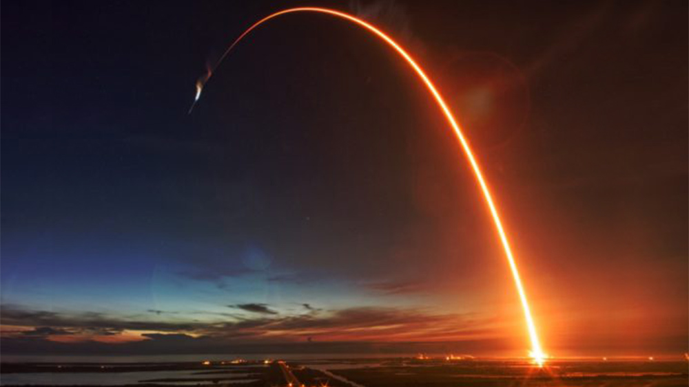 Missile flying in the night sky.