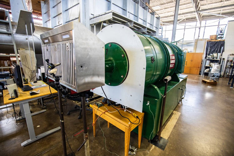 A residential range hood attached to a testing machine