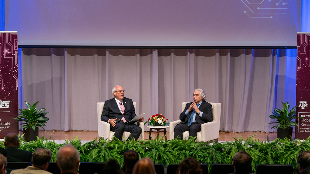Ray Rothrock and Ernest Moniz sitting on stage 