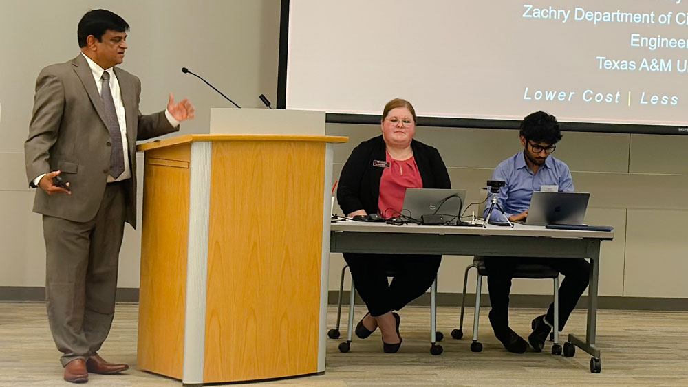 Center for Infrastructure Renewal Director Dr. Anand Puppala speaks at the podium during a meeting.