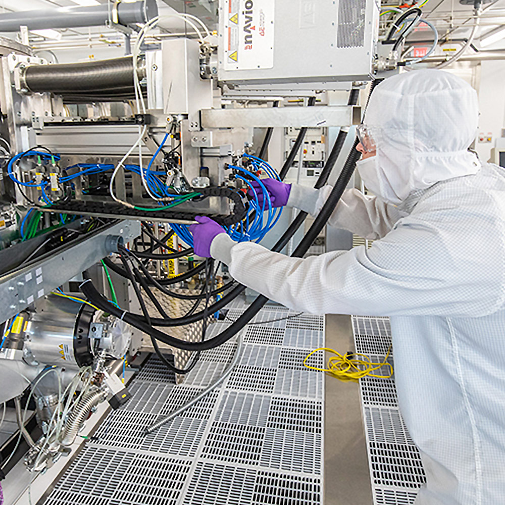 researcher handling large equipment machinery